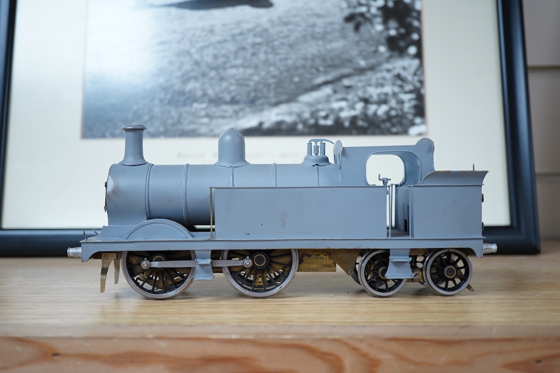 Eleven 0 gauge model railway items including; a bogie stake wagon, two mineral wagons, a North British coal wagon and two further open wagons, a partly constructed brake van, together with a Lima LMS 4F locomotive, two L